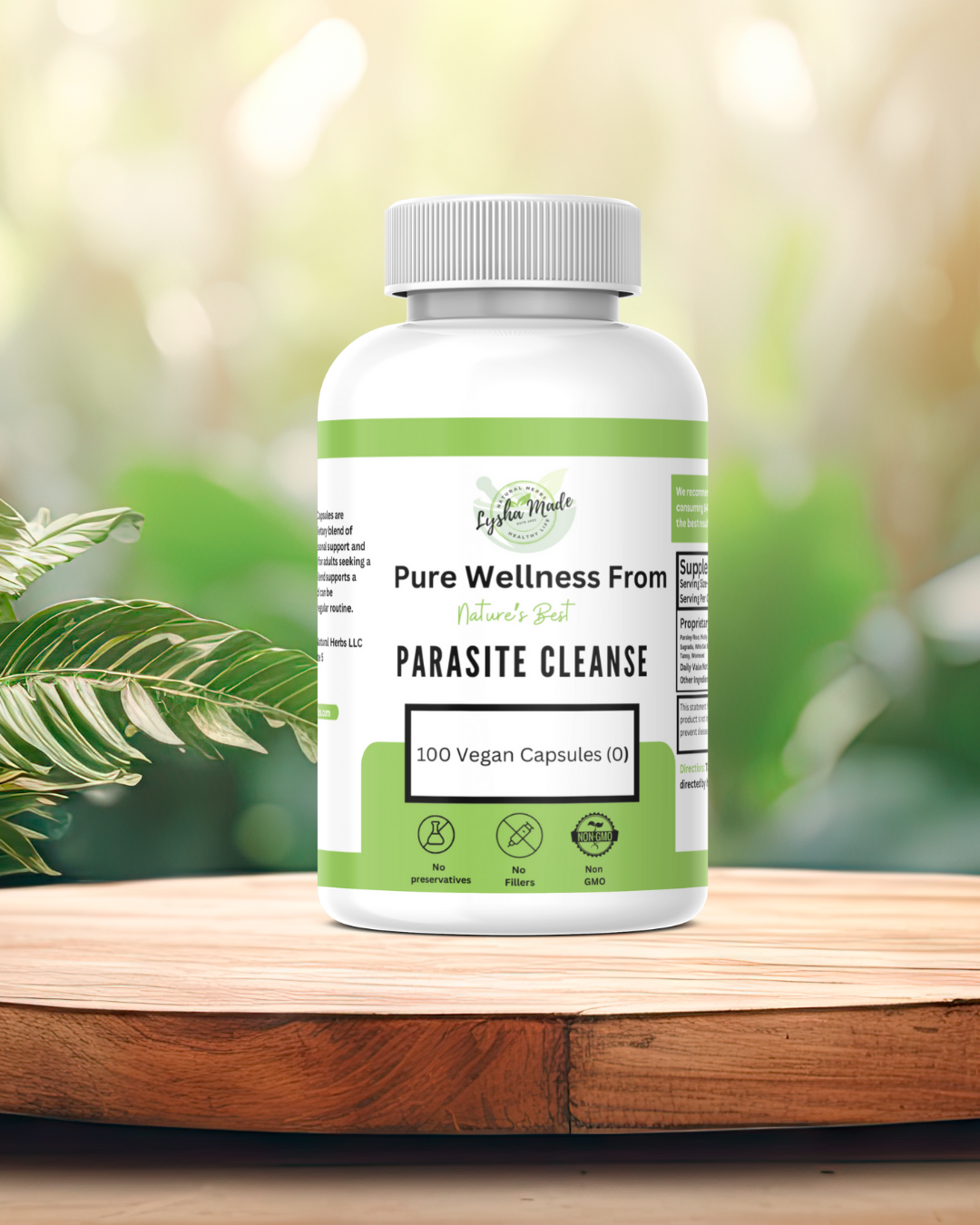Parasite Cleanse supplement bottle with 120 vegan non-GMO capsules on wooden table with green plant background – natural detox herbal formula